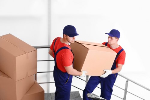 Packed boxes and furniture prepared for removal in a Kennington property