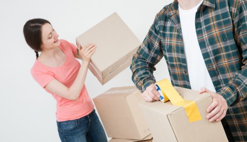 Trained movers carrying furniture with care