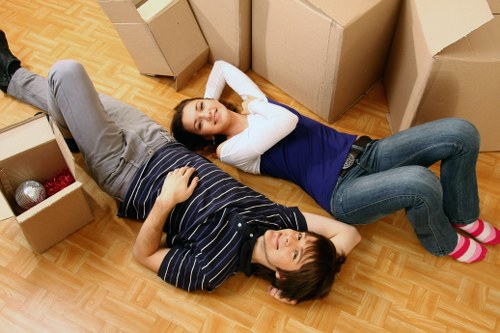 Local removalists unloading furniture into a new home