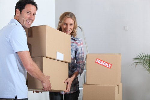 Professional movers handling boxes and furniture in Kennington