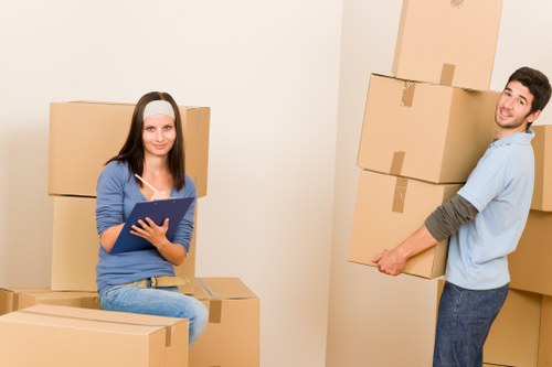 Small van moving boxes and household items in Kennington